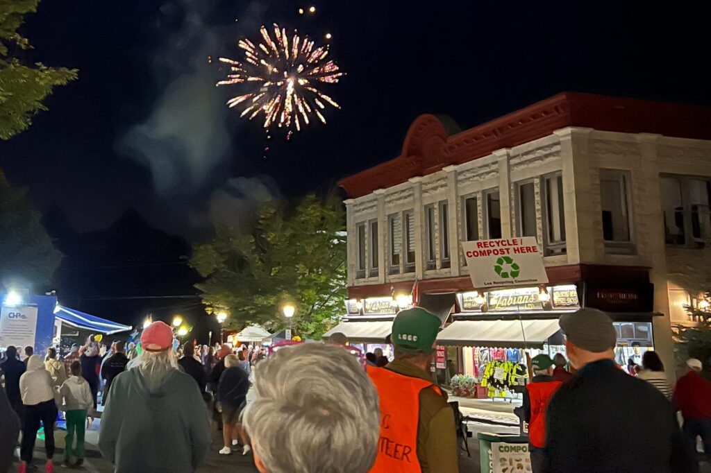 Crowd gathered along Main Street in downtown Lee watching the Founders Weekend fireworks