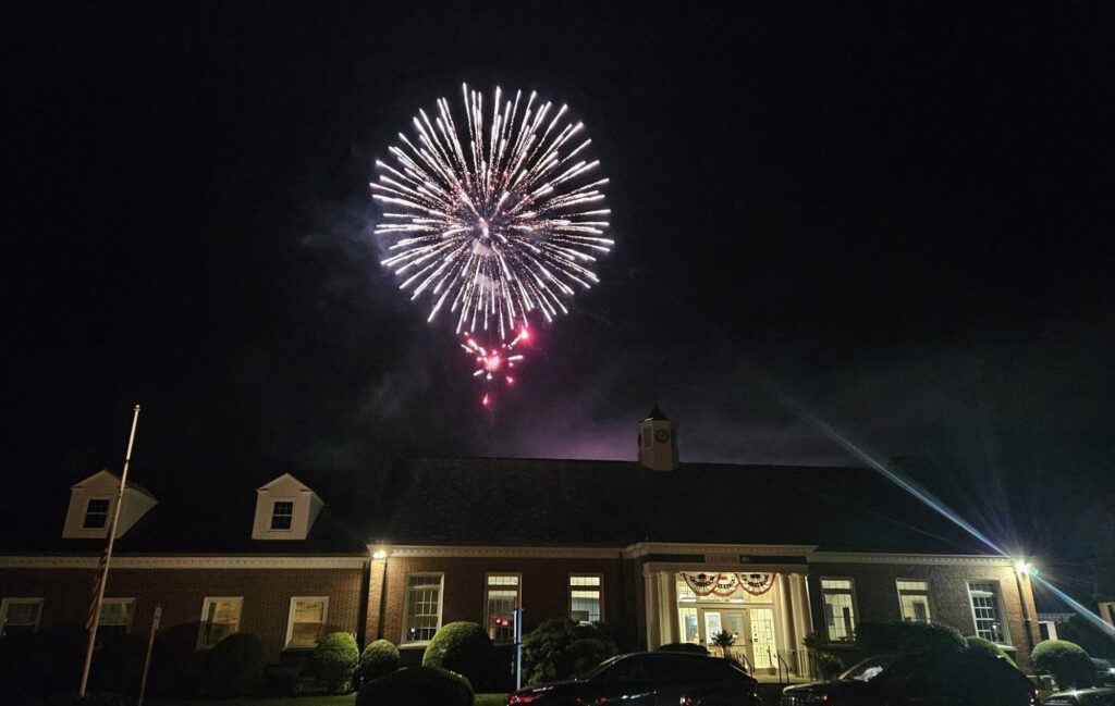 A second fireworks burst above Lee Bank during the Taste of Lee celebration