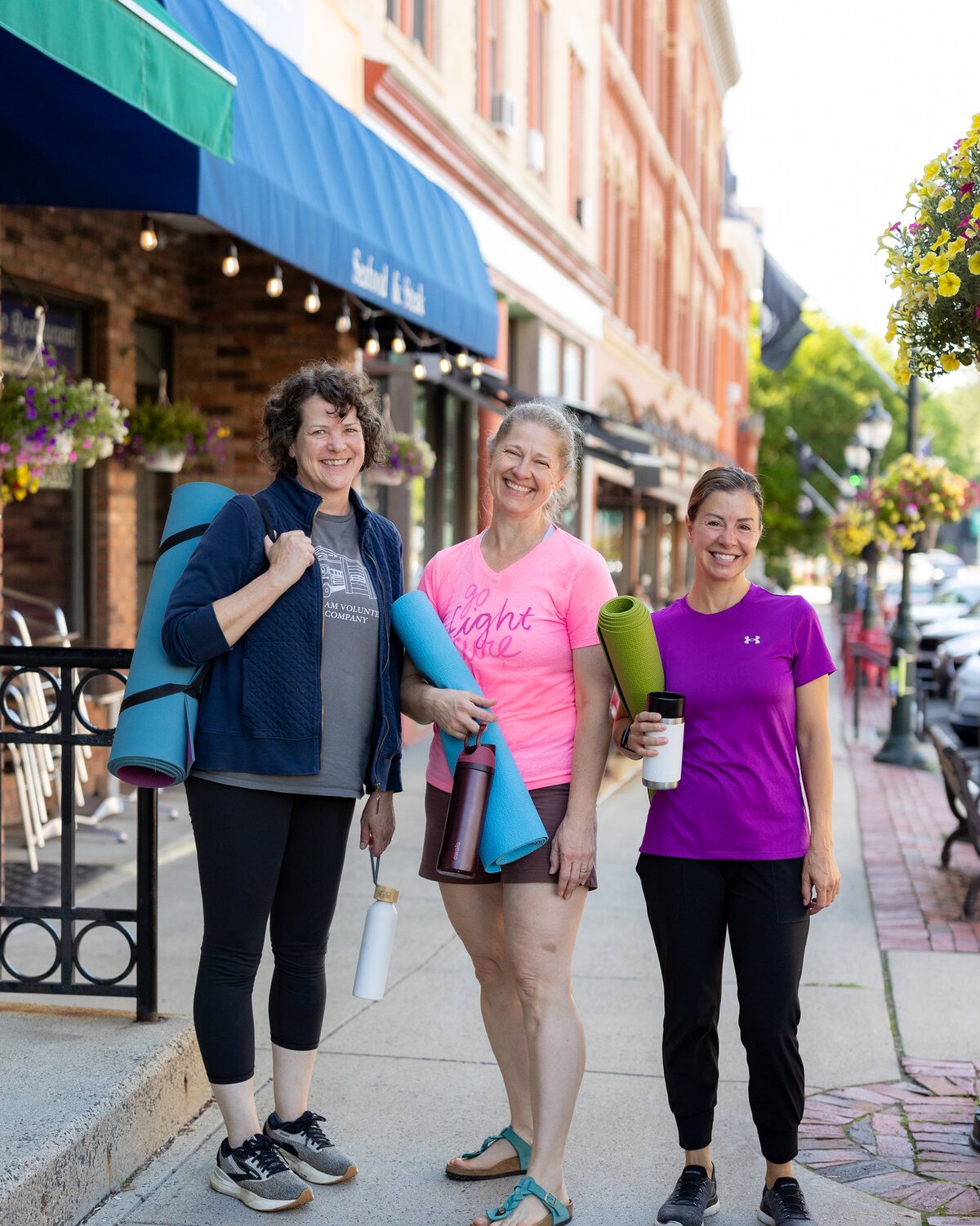 Friends walking together through downtown Lee