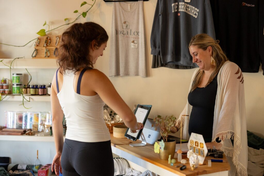Shoppers browsing products at a local Lee boutique counter