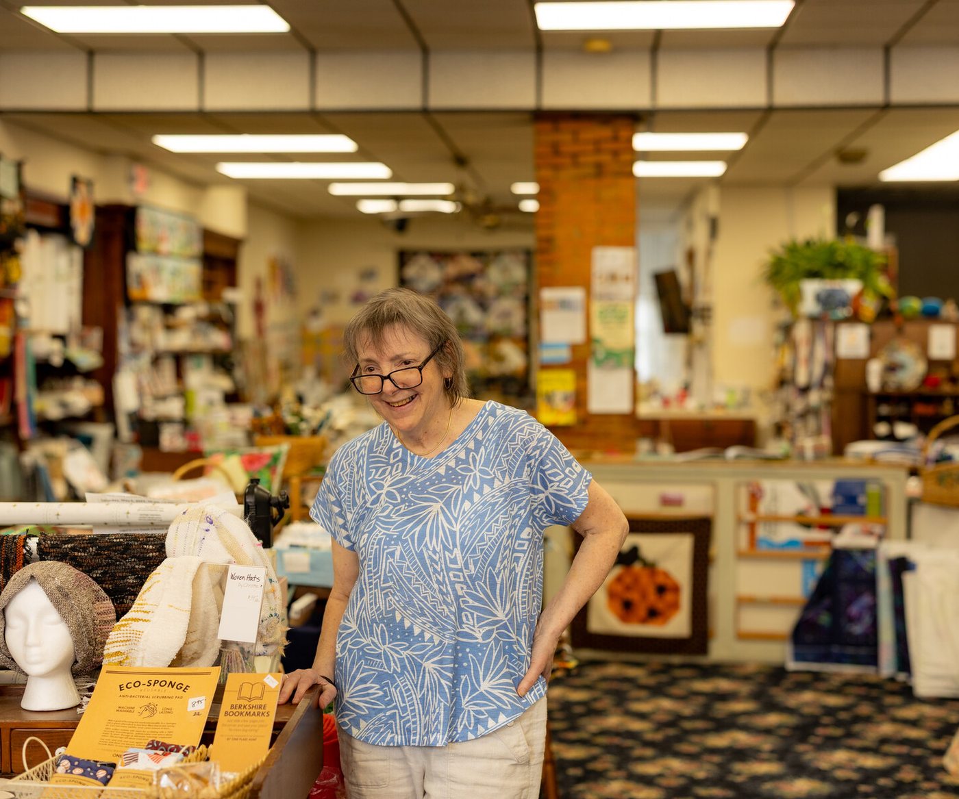 A shop owner inside her Lee retail store