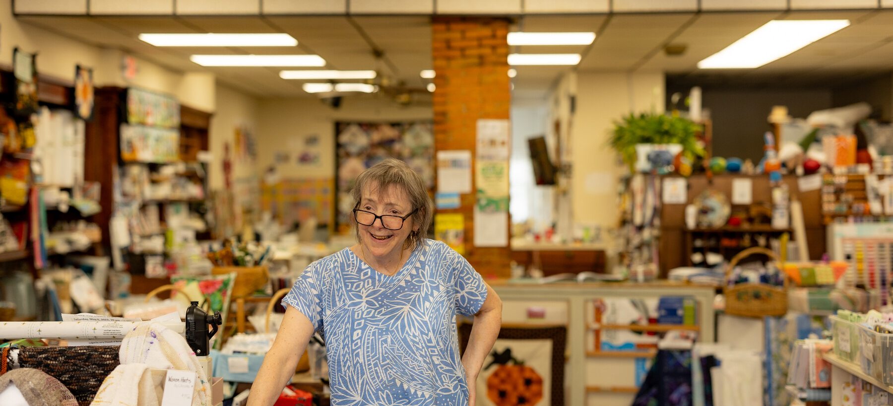 Owner inside a Lee fabric and quilt shop