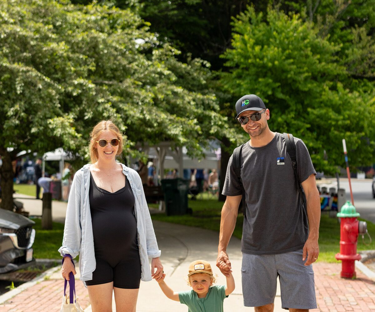A family walking together through downtown Lee
