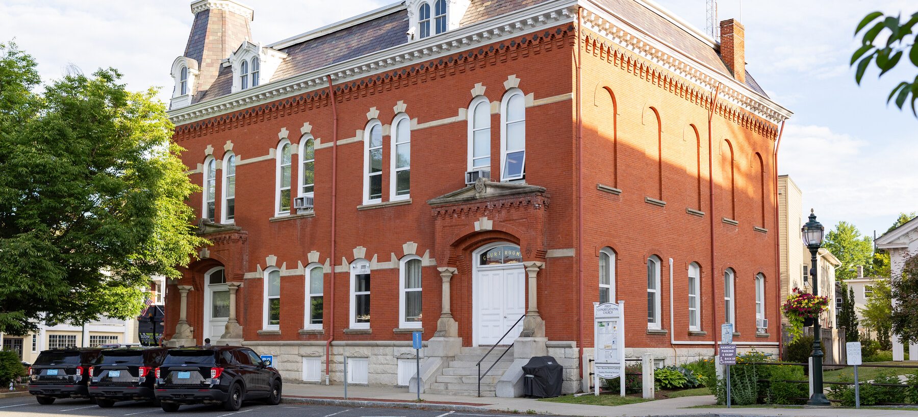 The historic brick Memorial Hall building in Lee