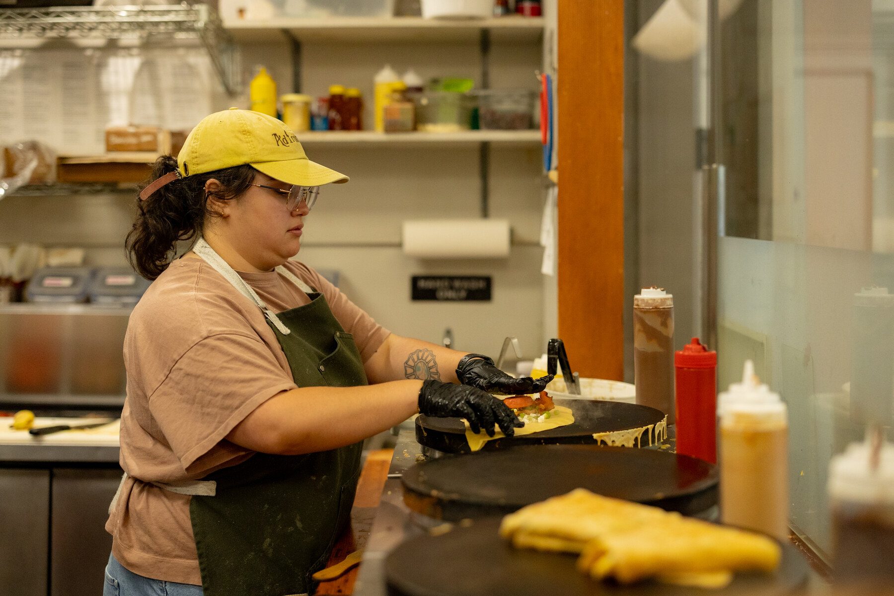 Chef preparing a dish in a Lee restaurant kitchen
